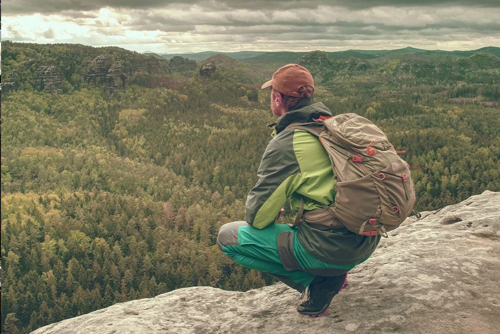 Tourist with backpack hike on trek. Trekking in mountains